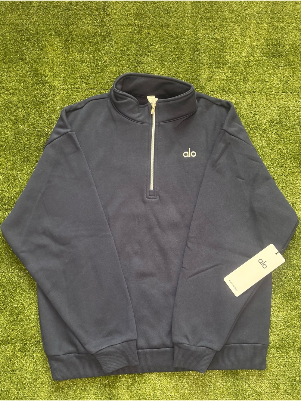 ALO Yoga Men’s Black Zip-Up Sweater with Gold Logo Accent